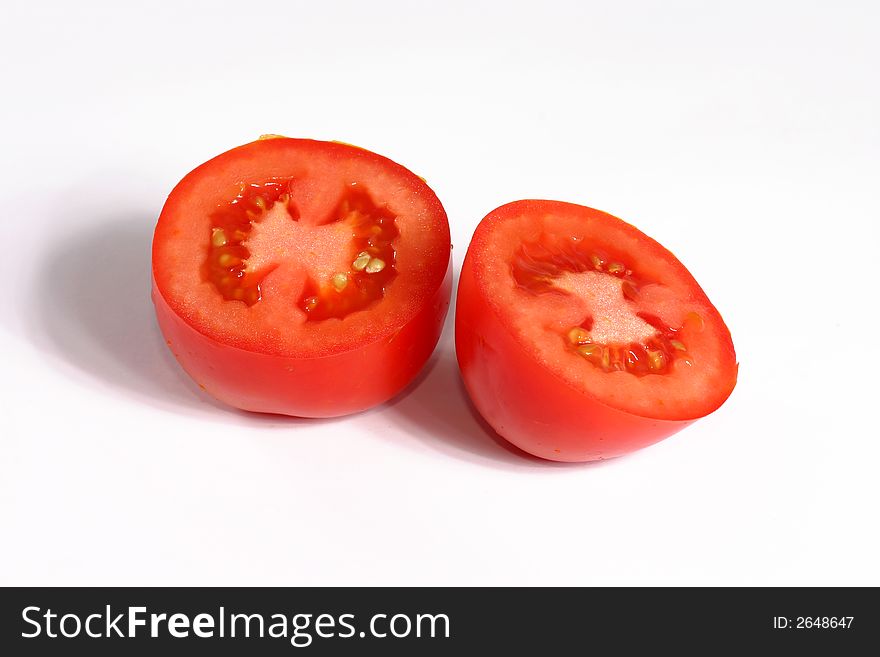 Full view of fresh tomato slices on the white background