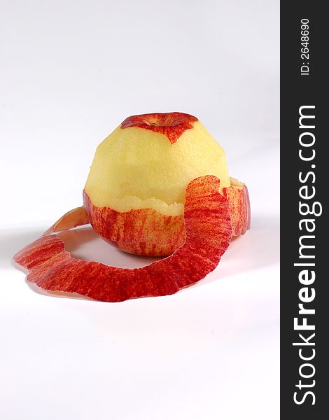 Fullview of fresh apple with its peel on the white background