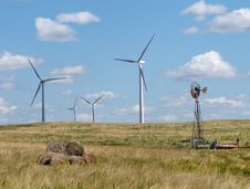 Old And New Windmills In A Rural Pasture Royalty Free Stock Photo