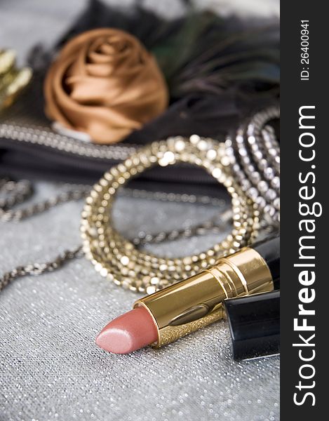 Pink lipstick and accessories background