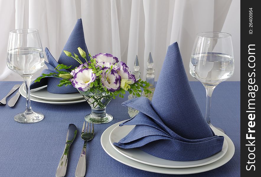 Fragment table setting with a decorative folded napkin