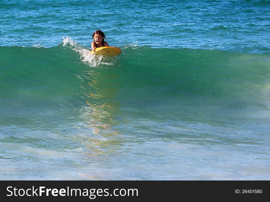 Surfing Girl On A Wave