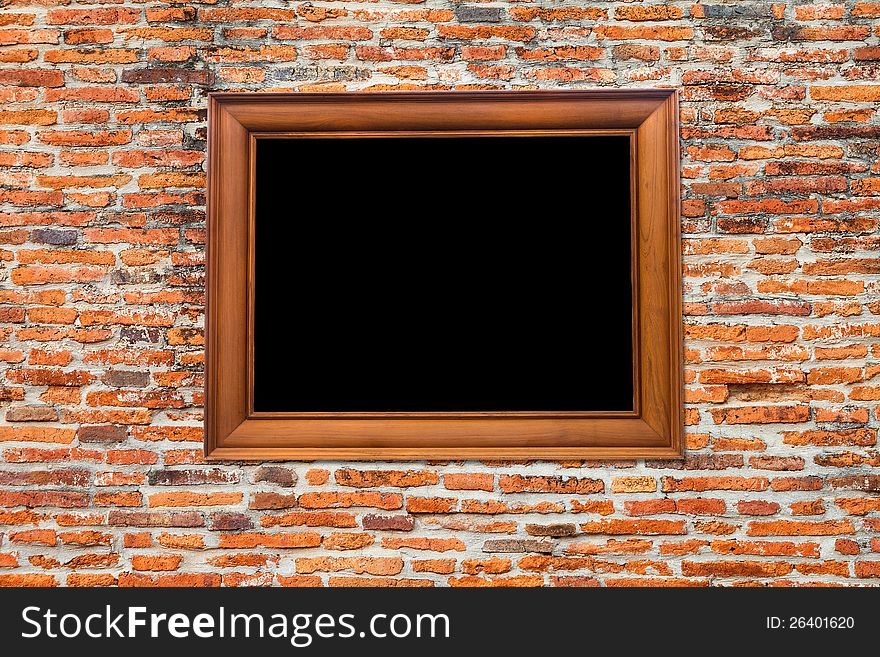 Wooden Photo Frame on Old brick wall
