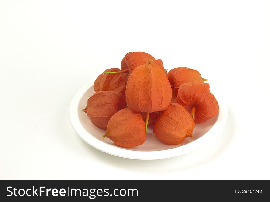 Beautiful colored fruits on plate  on white background. Beautiful colored fruits on plate  on white background