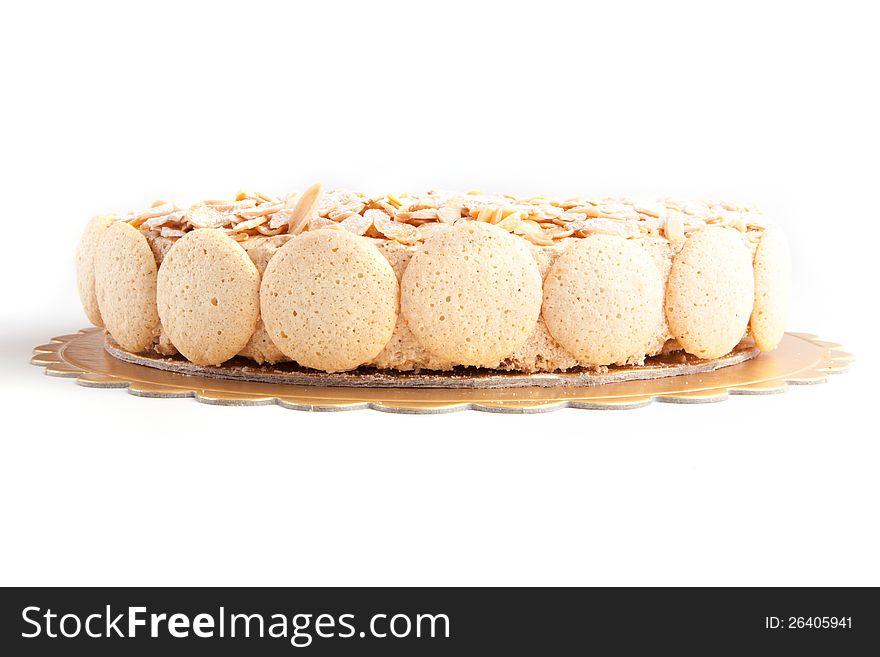 Nuts cake with macaroons on white