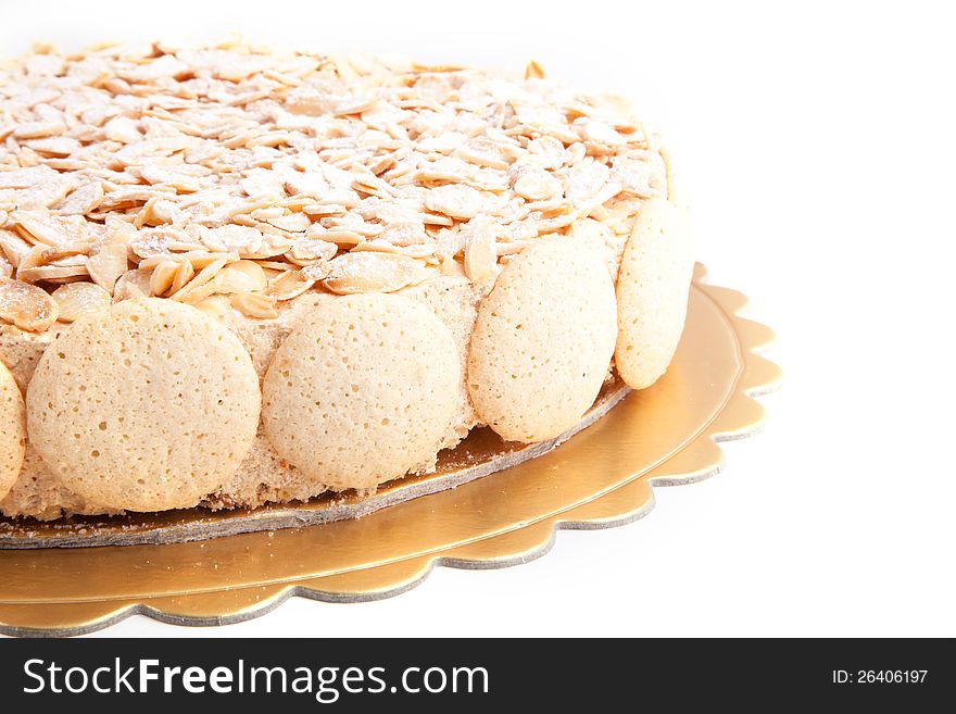 Nuts cake with macroons on white