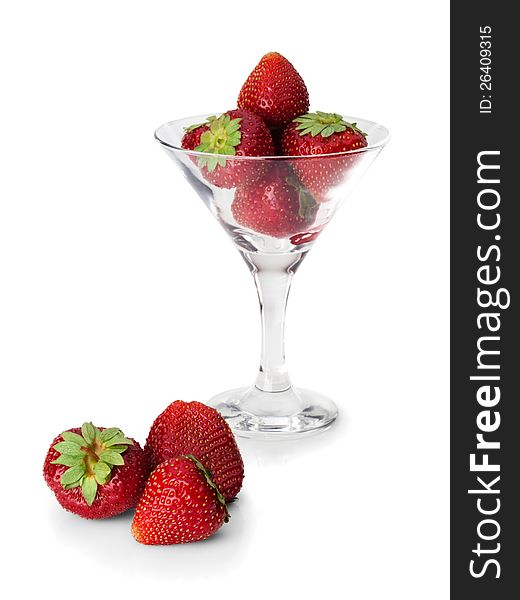 Strawberry in a glass and near to it on a white background. Strawberry in a glass and near to it on a white background.
