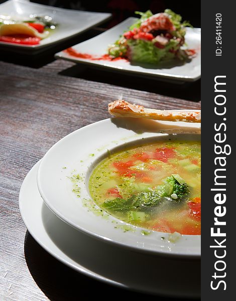 Three dishes on a wooden table. macro. Three dishes on a wooden table. macro