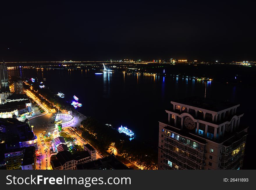 This image was taken from the top of an apartment and show Harbin, China illuminated at night. This image was taken from the top of an apartment and show Harbin, China illuminated at night.
