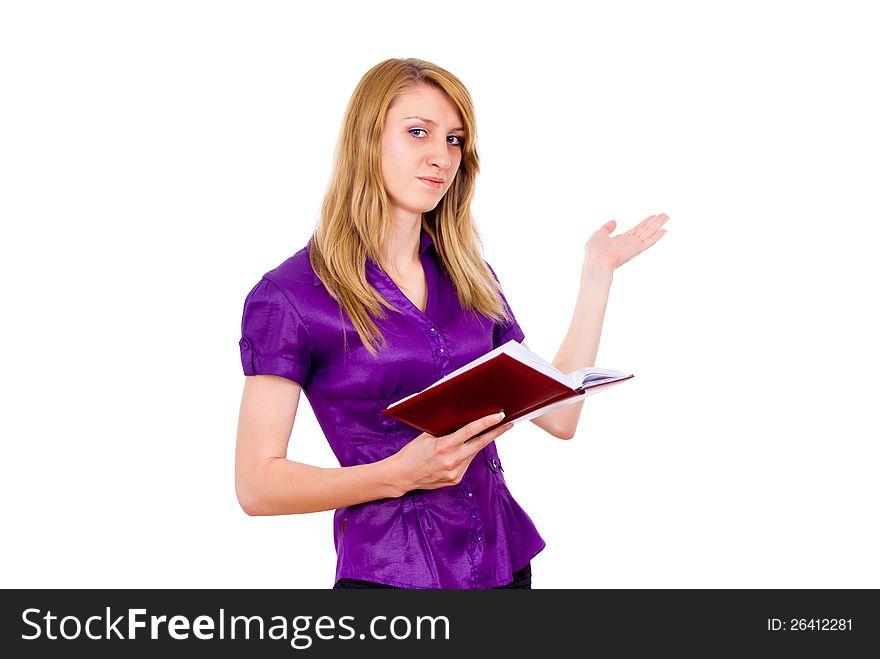 The girl keeps a book and indicates isolated on white background