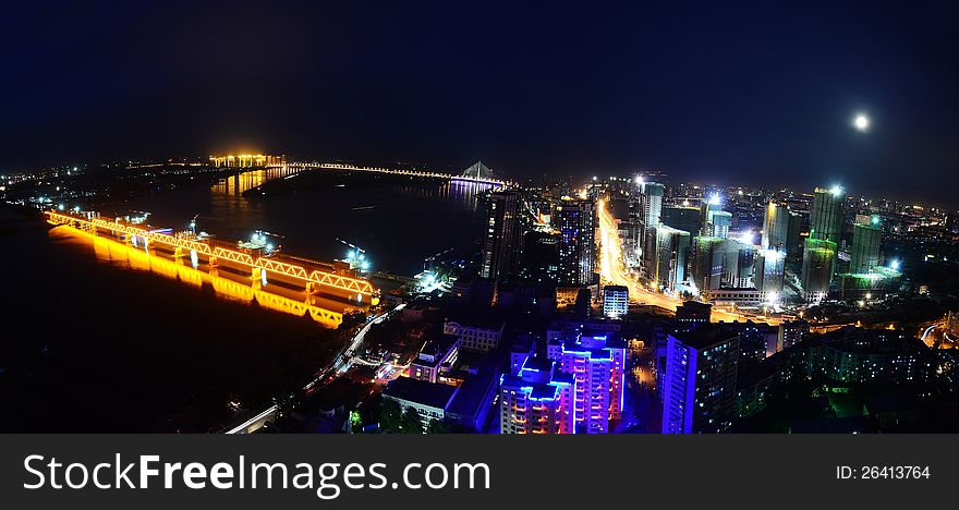 This image was taken from the top of an apartment and show Harbin, China illuminated at night. This image was taken from the top of an apartment and show Harbin, China illuminated at night.
