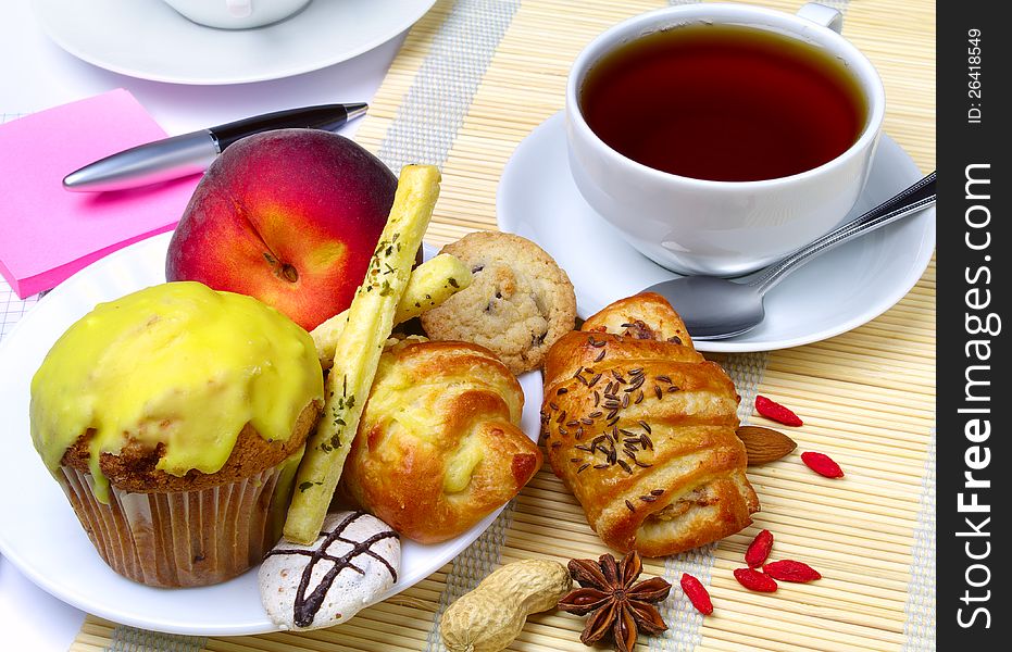 Cup of tea, cookies, notebook and pen. Cup of tea, cookies, notebook and pen