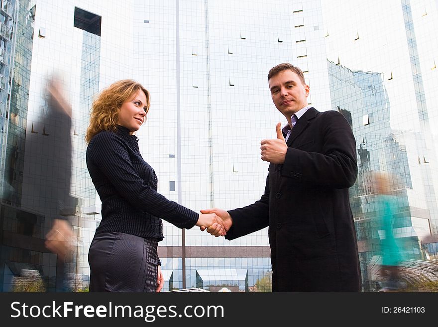 Successful business team striking a bargain (deal). Two business people shaking hands. Successful business team striking a bargain (deal). Two business people shaking hands