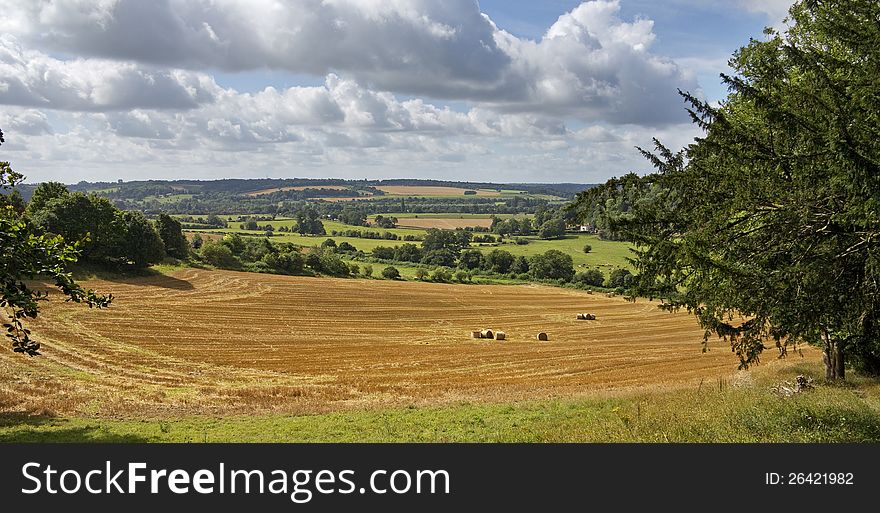 An English Rural Landscape with round bales of Hay. An English Rural Landscape with round bales of Hay