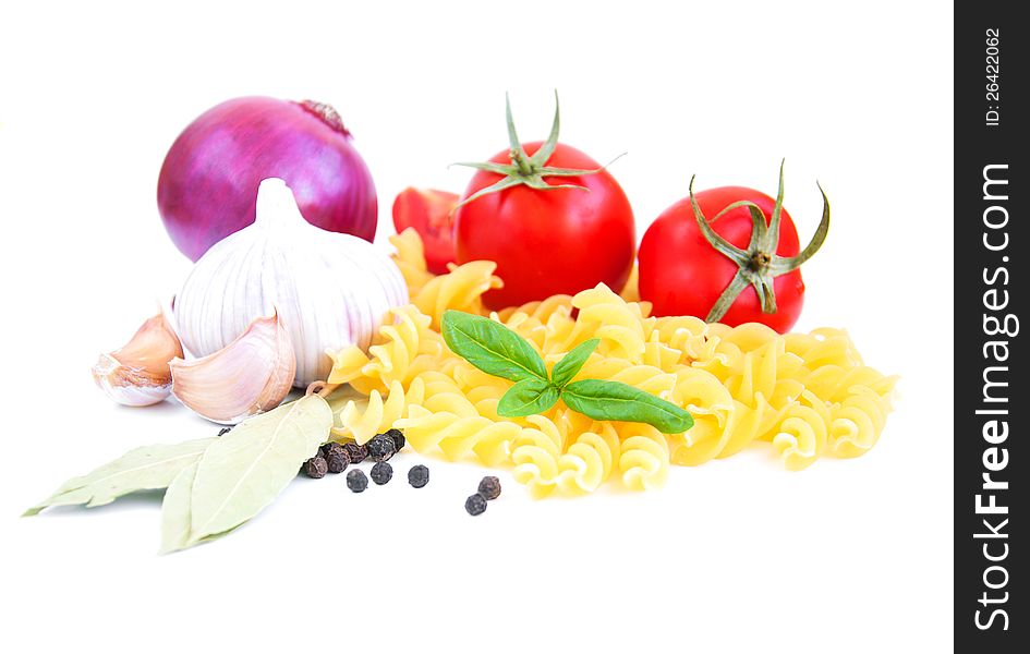 Pasta, spices and vegetables on a white background. Pasta, spices and vegetables on a white background