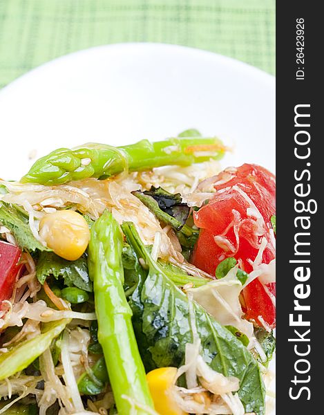 Salad with green leaves, asparagus and tomatoes. Salad with green leaves, asparagus and tomatoes