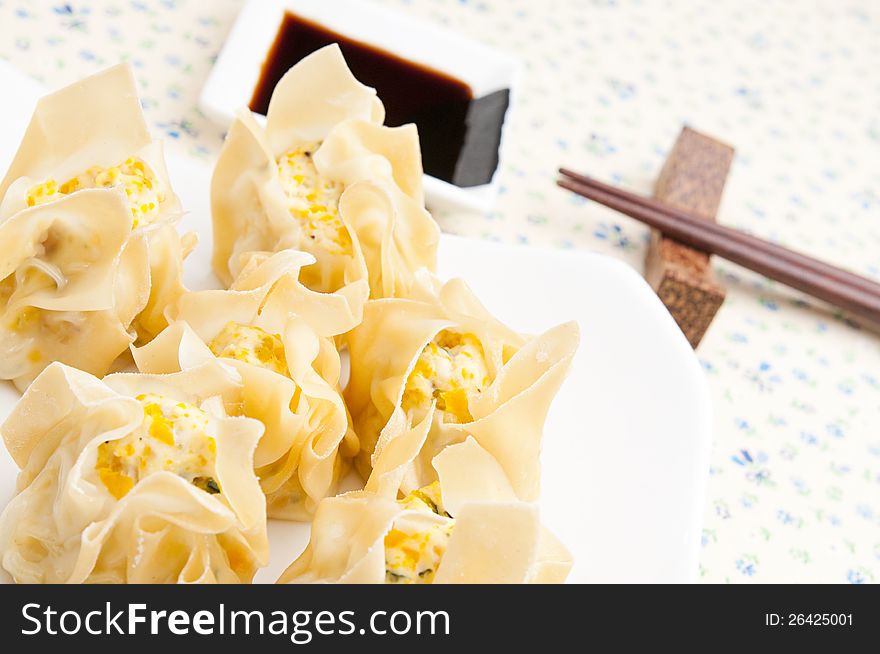 Steamed dumplings on a small plate