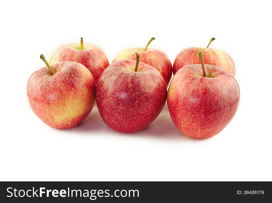 Lots of red apples on white background