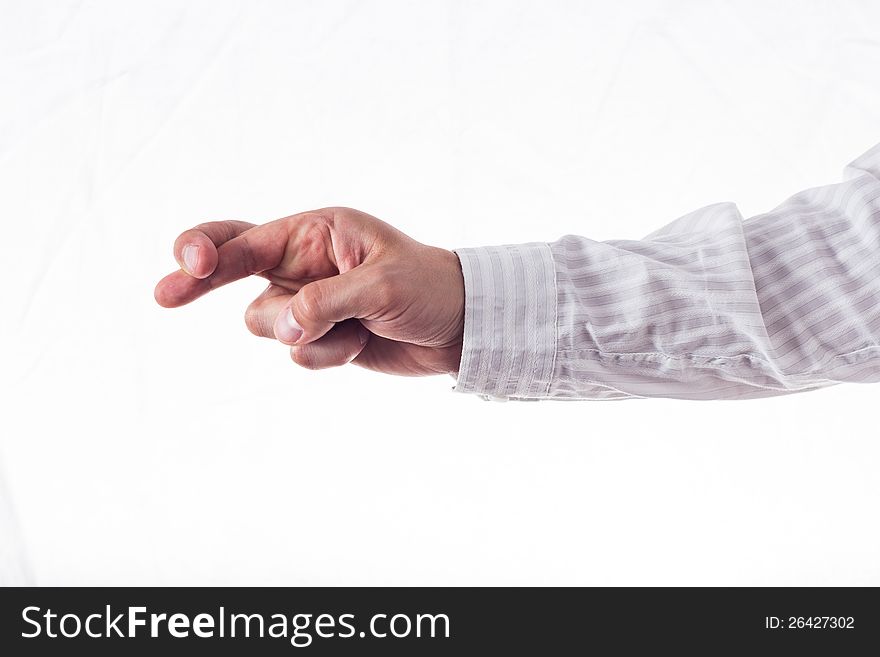 Hand with crossed fingers in striped shirt, isolated on white.