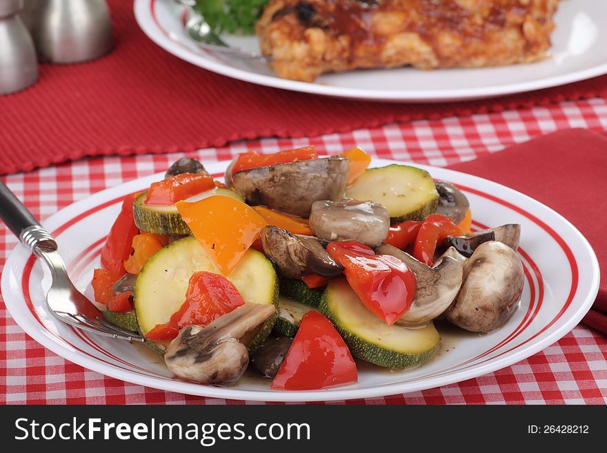 Salad with red and orange peppers, mushrooms and zucchini. Salad with red and orange peppers, mushrooms and zucchini