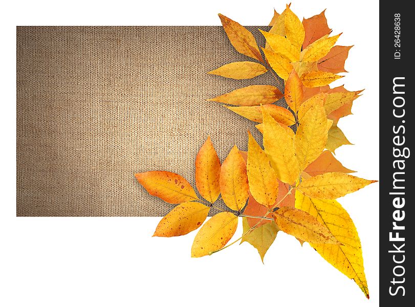 Border made from autumn leaves on canvas background with free space for text. Border made from autumn leaves on canvas background with free space for text