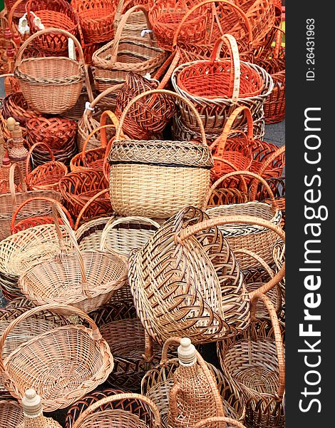Many beautiful wooden wicker baskets close-up