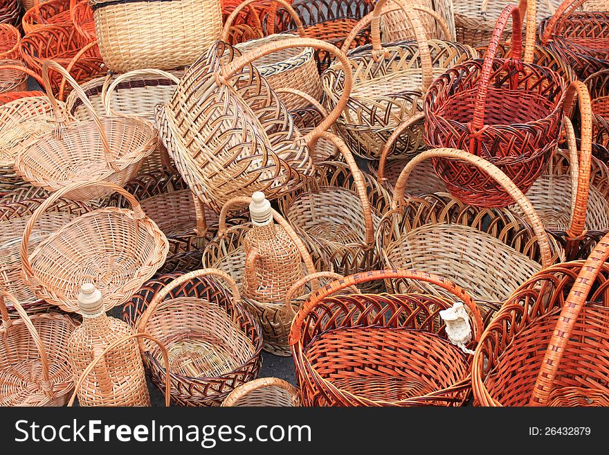 Many beautiful wooden wicker baskets close-up