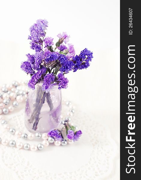 Bouquet of flowers and pearl beads. Bouquet of flowers and pearl beads