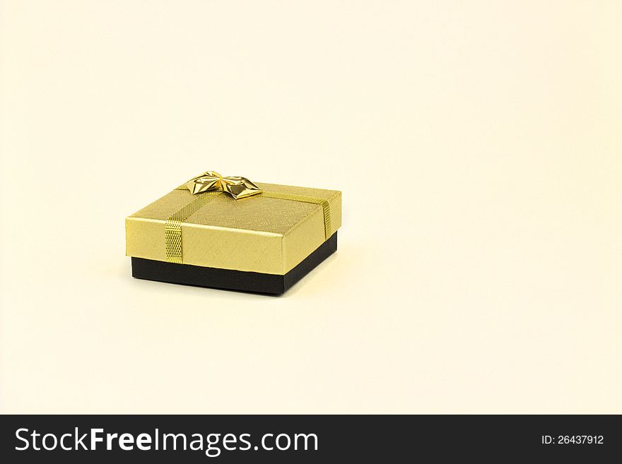 Fine image of isolated gift box with golden ribbon. Fine image of isolated gift box with golden ribbon