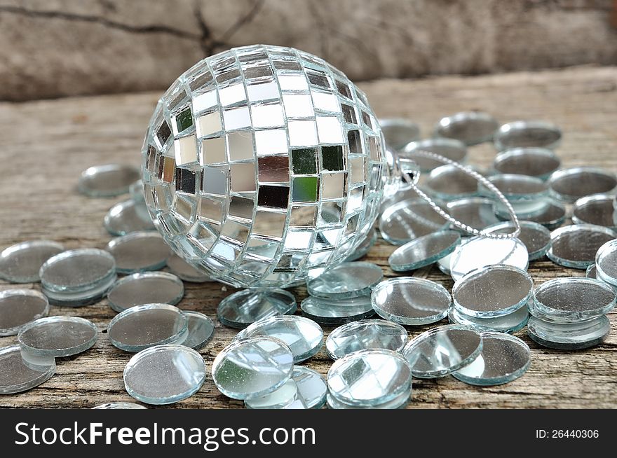 Mirror christmas ball on wooden background