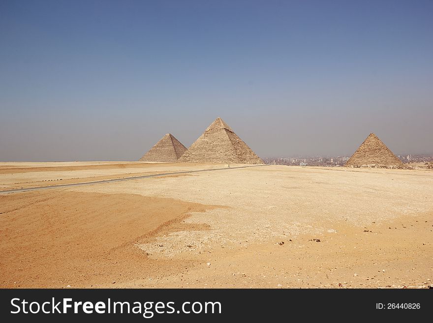 The Giza Necropolis is an archaeological site on the Giza Plateau, on the outskirts of Cairo, Egypt. This complex of ancient monuments includes the three pyramid complexes known as the Great Pyramids. The Giza Necropolis is an archaeological site on the Giza Plateau, on the outskirts of Cairo, Egypt. This complex of ancient monuments includes the three pyramid complexes known as the Great Pyramids.