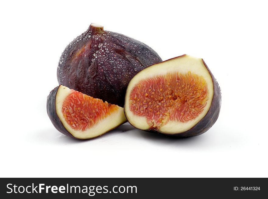 Two Perfect Ripe Figs full body and slices isolated on white background. Two Perfect Ripe Figs full body and slices isolated on white background