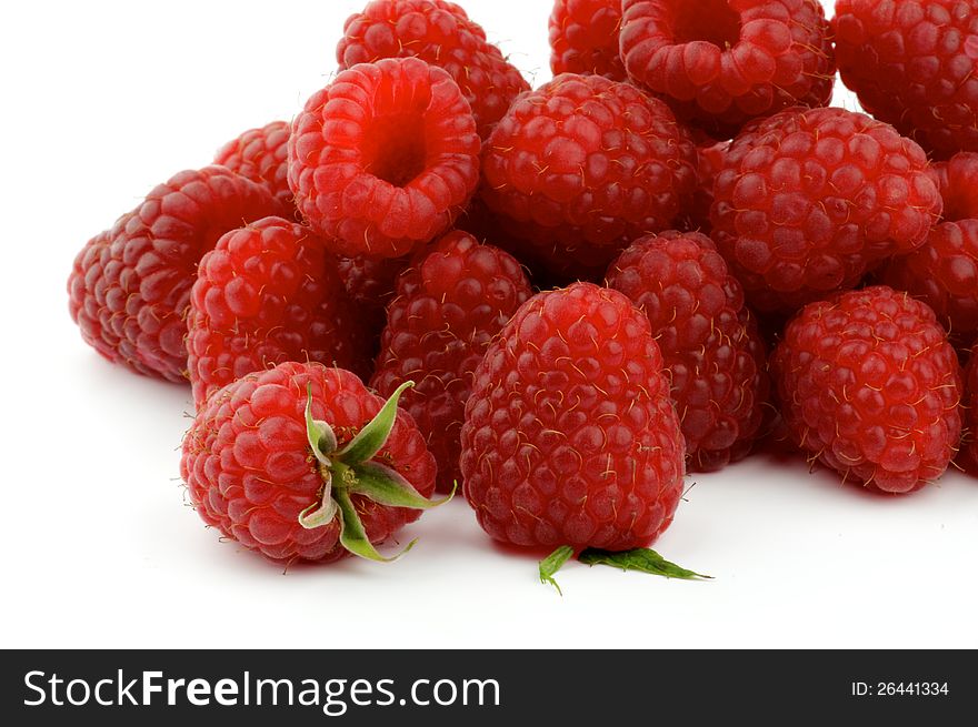 Heap of Perfect Ripe Raspberries close up isolated on white background
