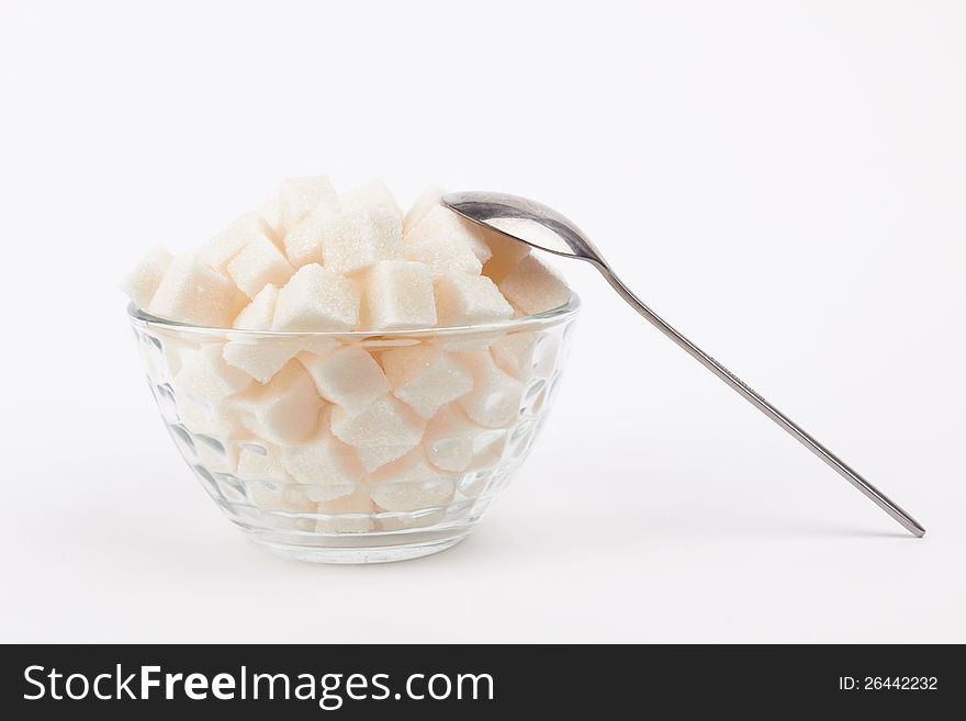 Cubes of sugar on the white background