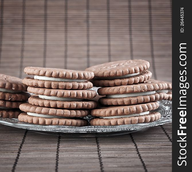 Chocolate cookies filled with white cream,close up