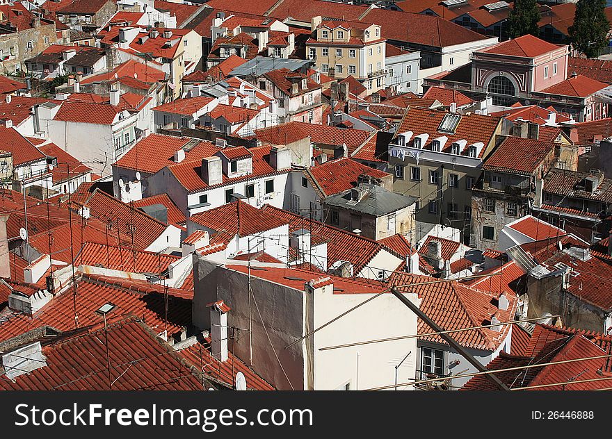 Red rooftops in the Portuguese capital Lisbon. Shot from a high viewpoint. Red rooftops in the Portuguese capital Lisbon. Shot from a high viewpoint