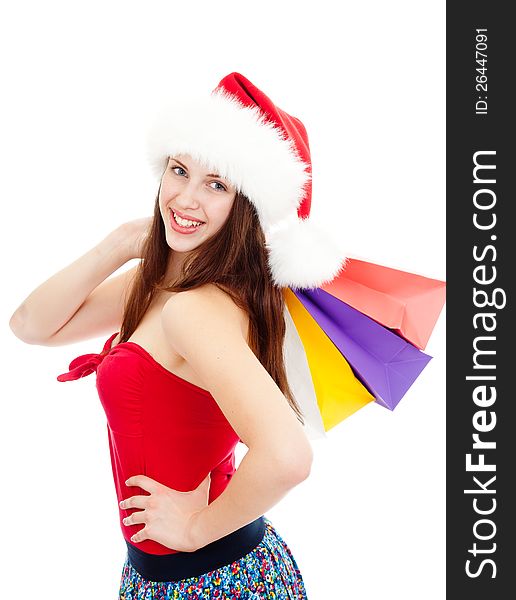 Cute girl in Christmas hat with colorful bags. Cute girl in Christmas hat with colorful bags