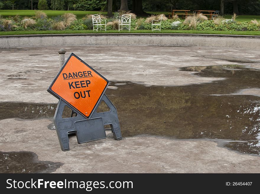 Empty fountain with danger keep out sign. Empty fountain with danger keep out sign