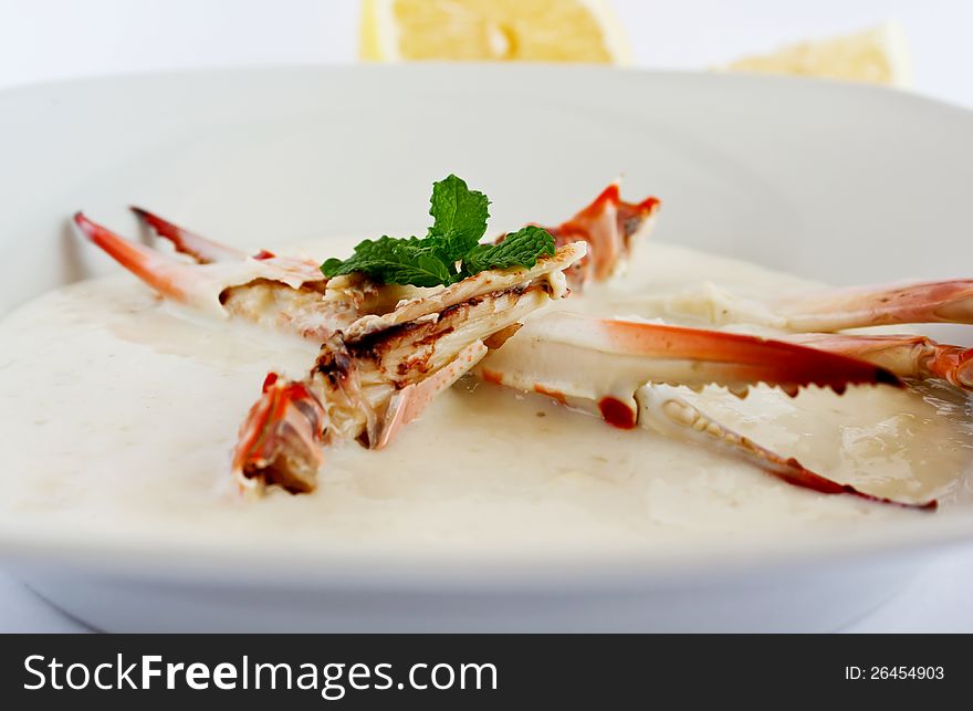 Crab soup with whole claw in the plate. Crab soup with whole claw in the plate.