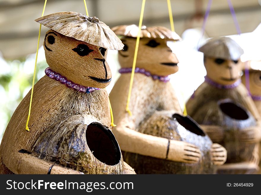 Cute wooden monkeys doll made of coconut shell a nice souvenir