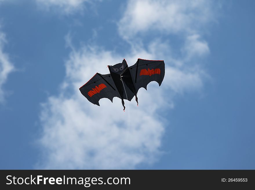 Kite in the sky in the form of a bat