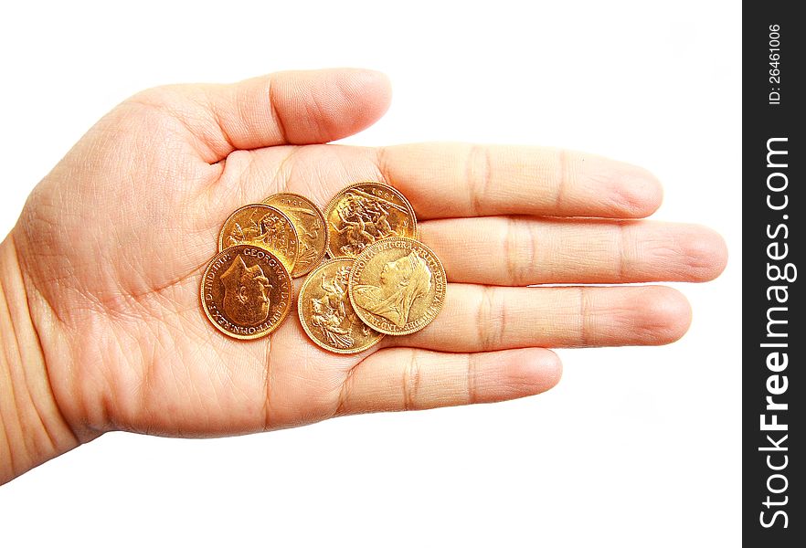 Woman hand holding gold coins on isolated white