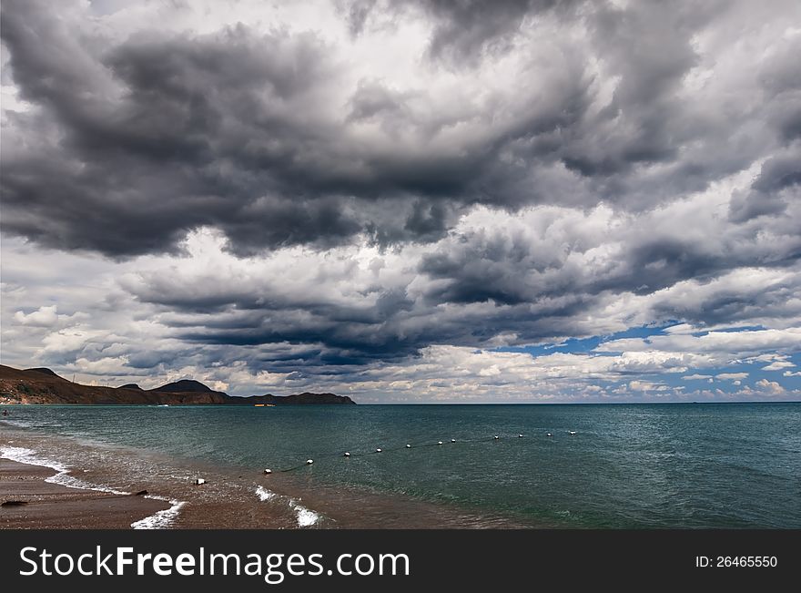 View of thunderstorm clouds above the sea. View of thunderstorm clouds above the sea