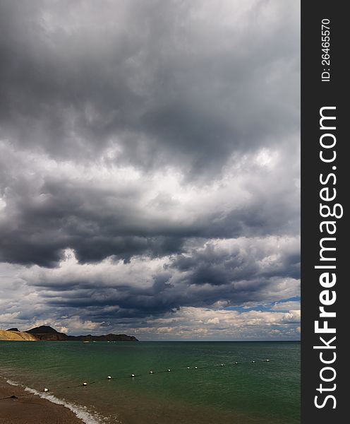 View of thunderstorm clouds above the sea. View of thunderstorm clouds above the sea