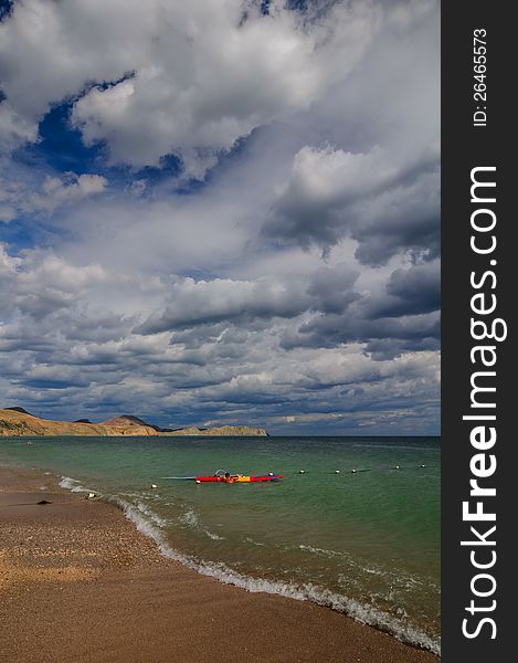 View of thunderstorm clouds above the sea. View of thunderstorm clouds above the sea