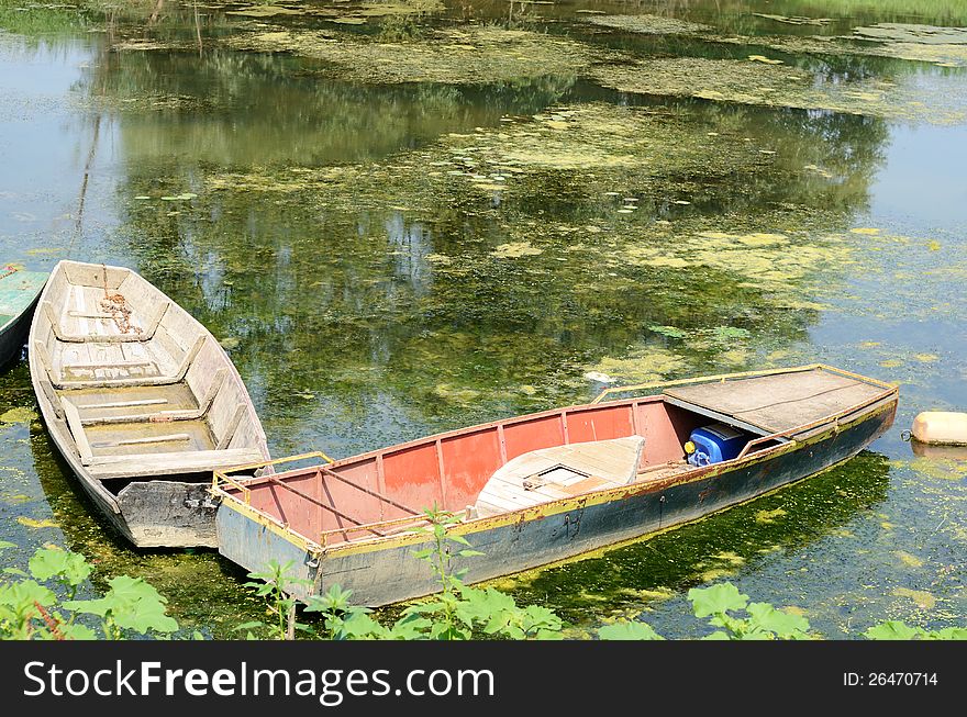 Two old fishing boats on water. Two old fishing boats on water