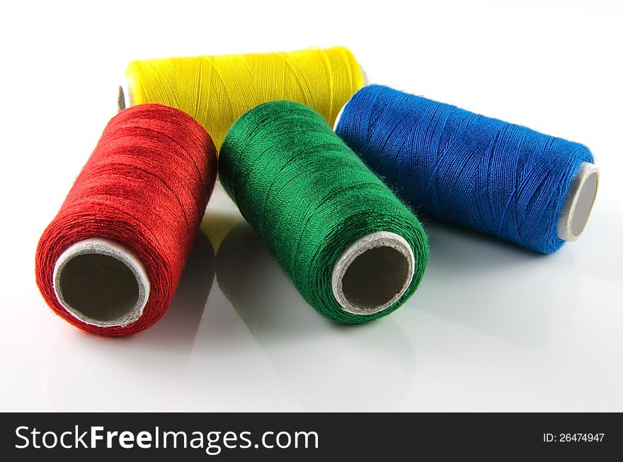 Some colorful spool of thread isolated on white background. Some colorful spool of thread isolated on white background