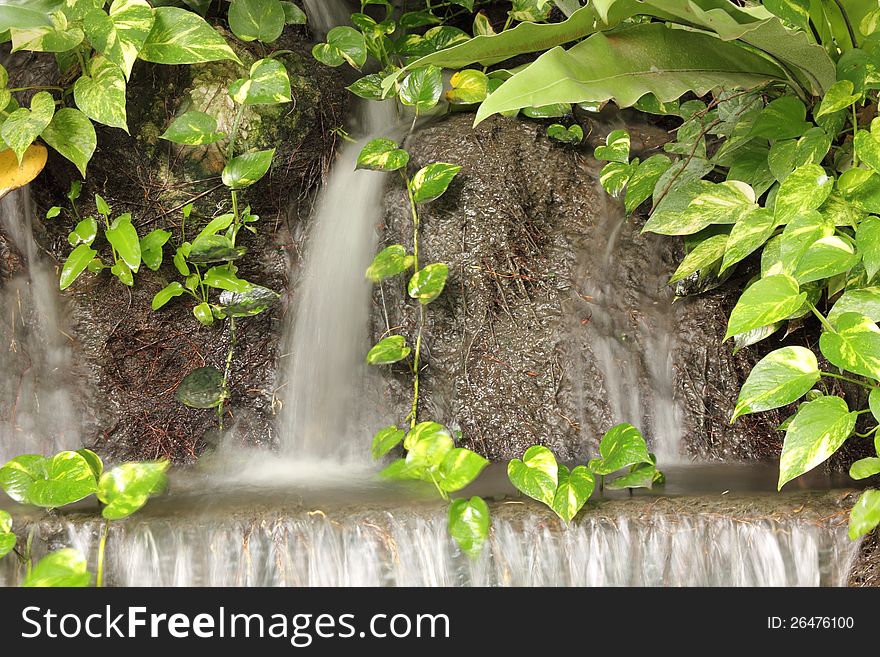 Waterfall in Japanese style garden. Waterfall in Japanese style garden.