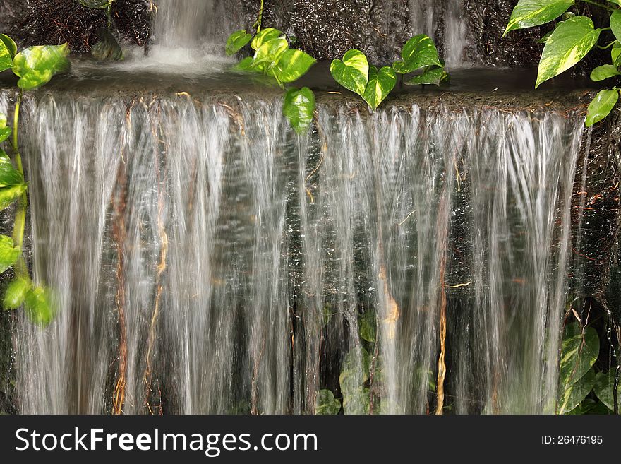 Waterfall in Japanese style garden. Waterfall in Japanese style garden.