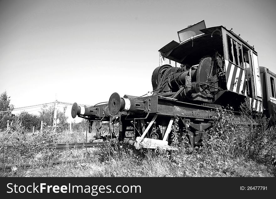 Black and white photo of an old abandoned industrial train. Black and white photo of an old abandoned industrial train